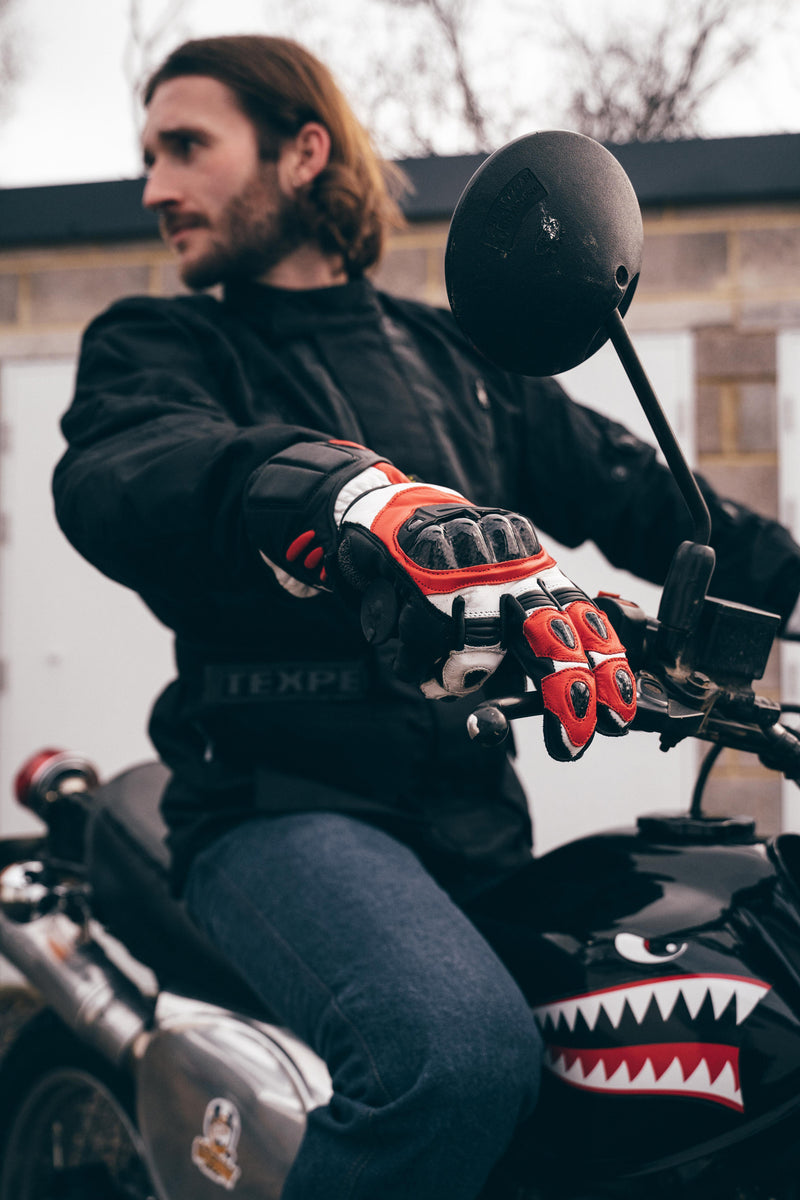 red and black motorcycle gloves